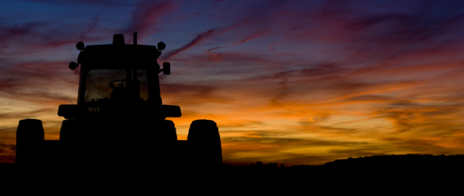 Tractor silhouetted against a West Texas sunset